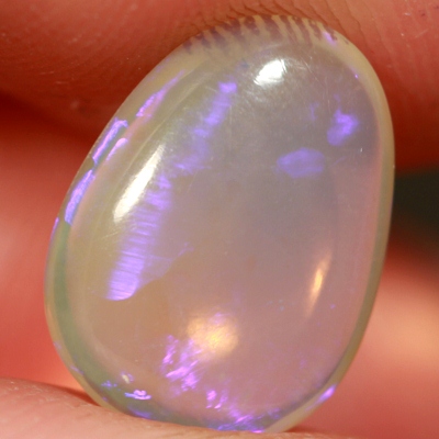 SOLID CRYSTAL OPAL Transparent with a pretty purple jumping